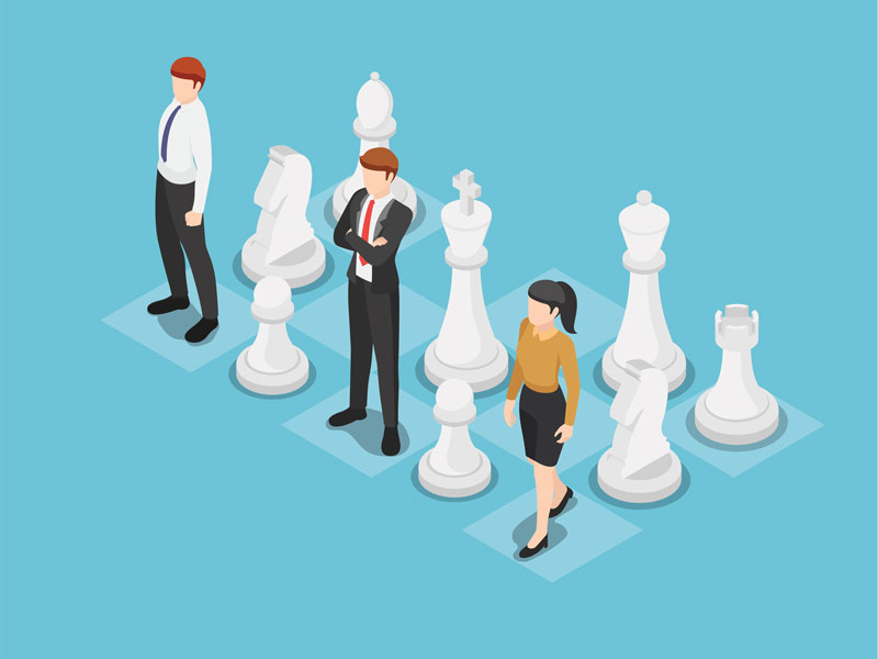 Business team standing on chess board with chess pieces