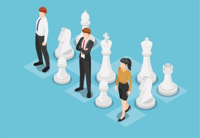 Business team standing on chess board with chess pieces